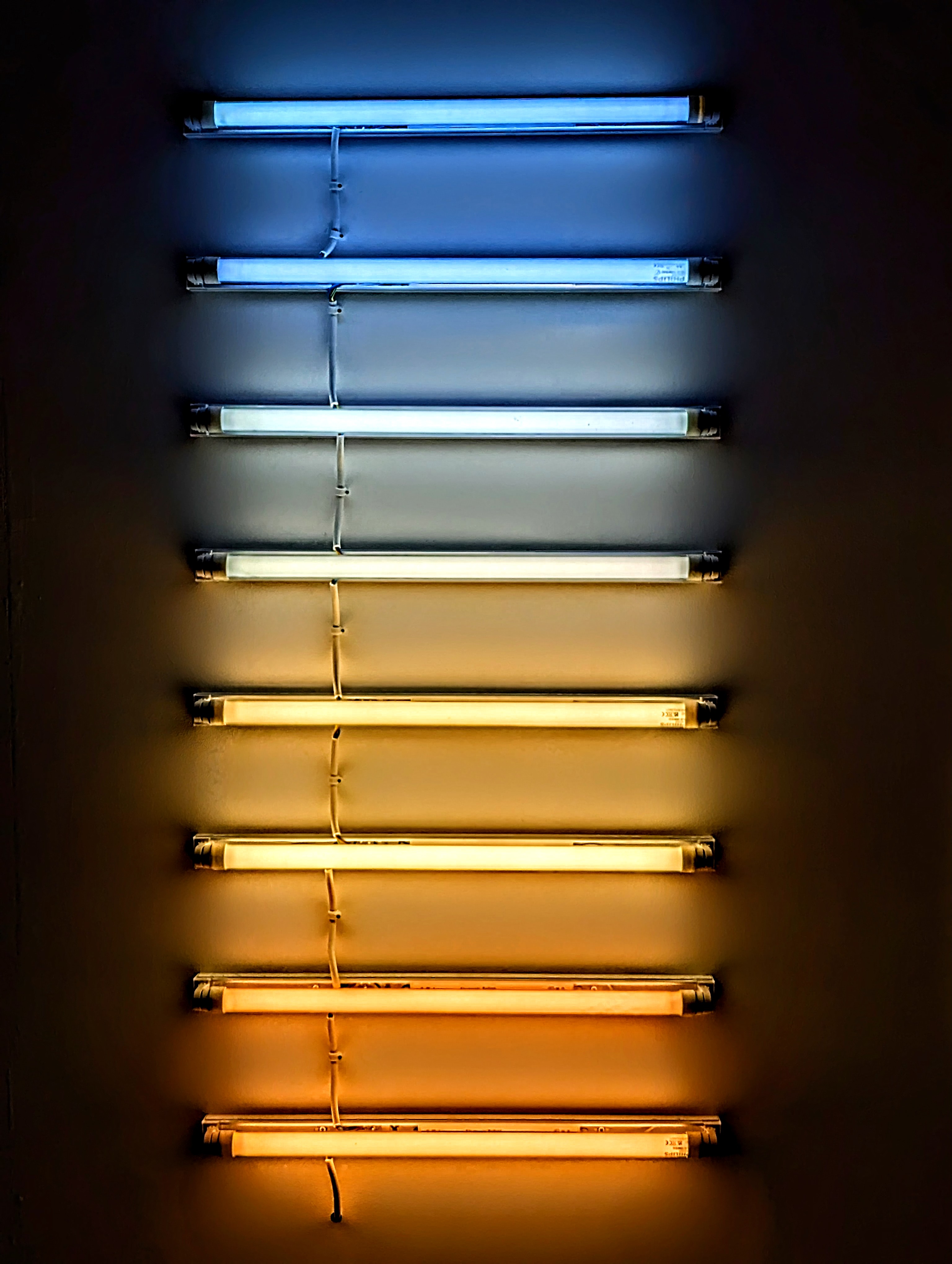 A fluorescent light installation of colours matching to the sky at sunset