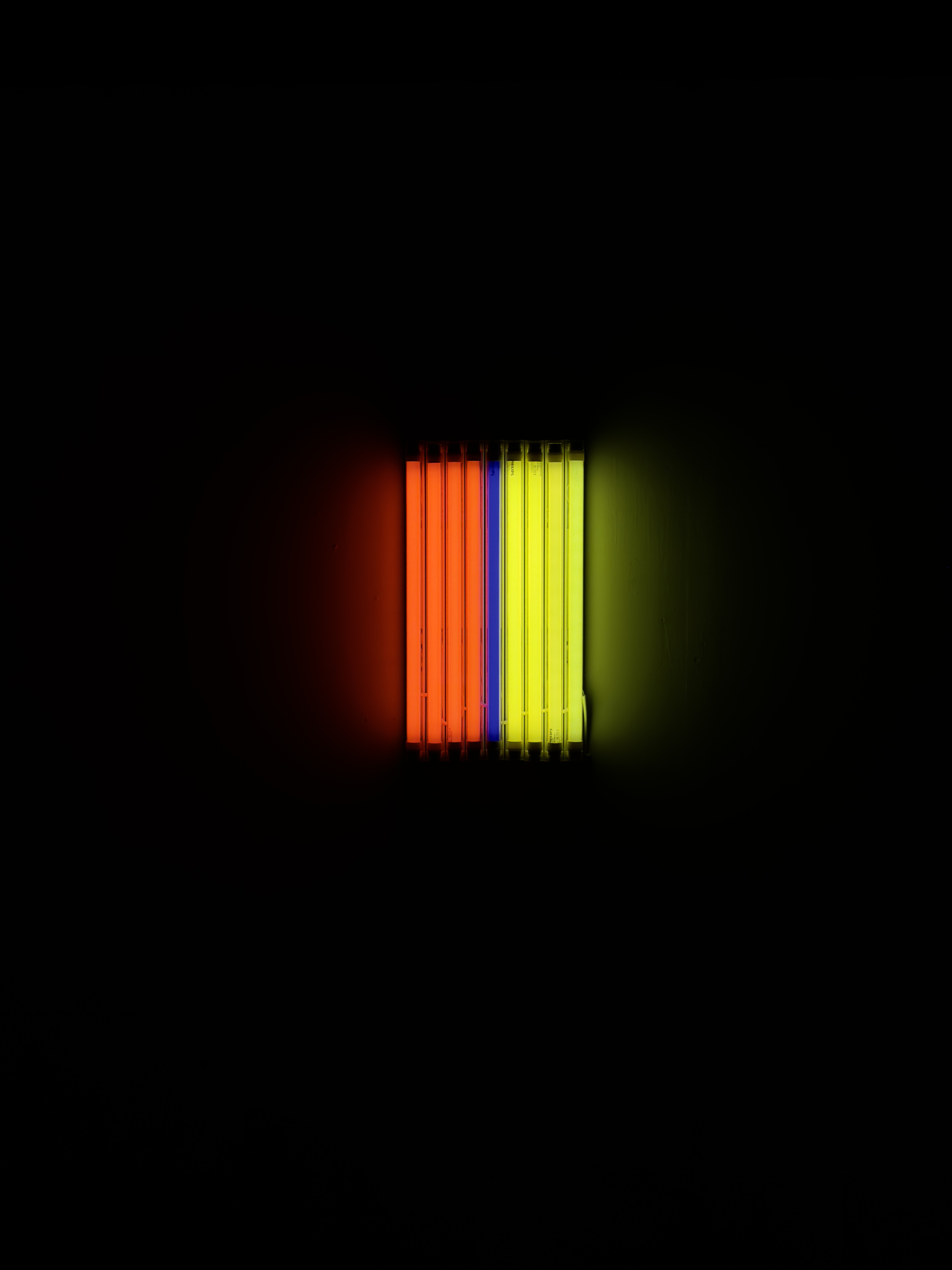 A row of fluorescent lights in red, yellow and blue, responding to the Barnett Newman painting 'Who's Afraid IV'