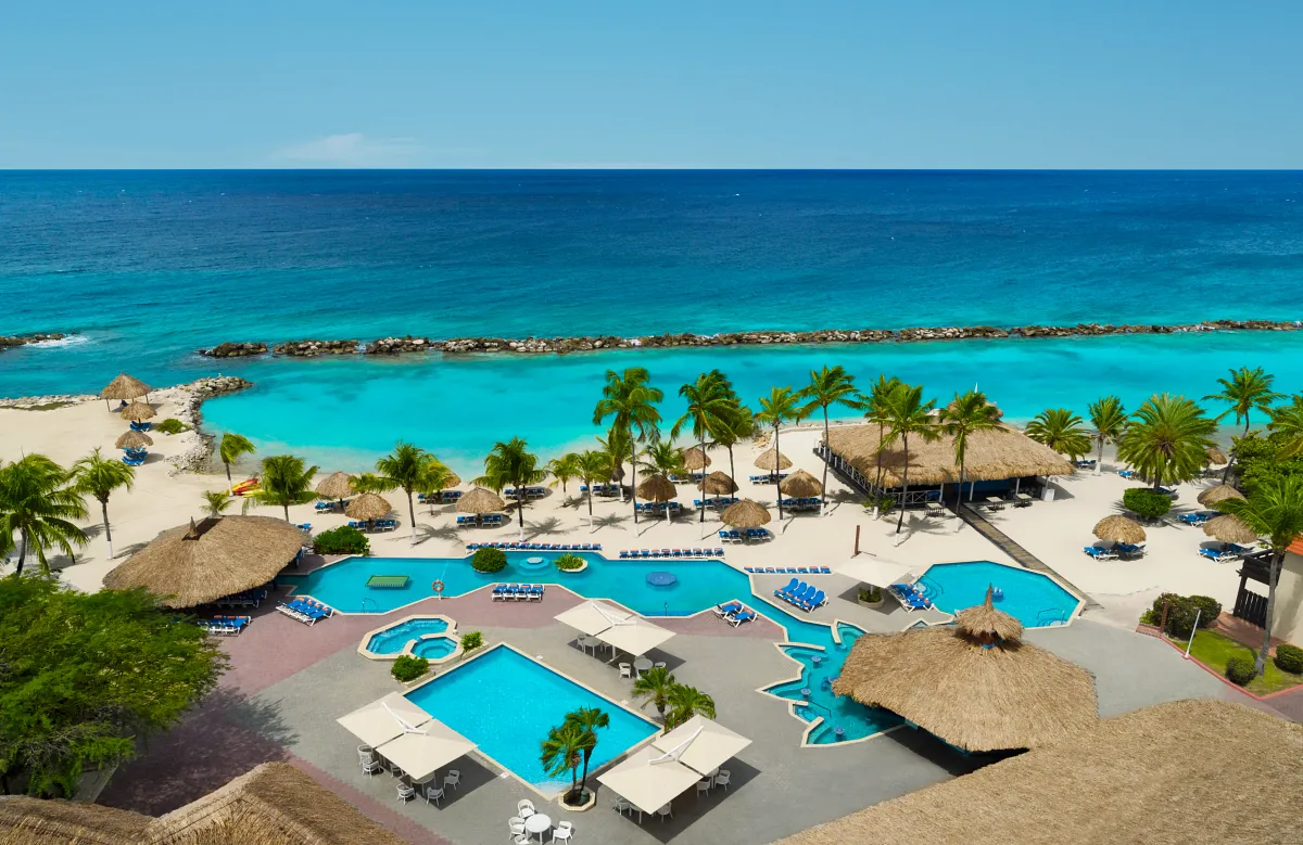 SUCUR-EXT-Aerial-MainPool-1A-RGB-CB.webp
