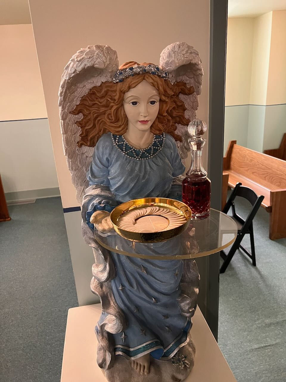 Communion and wine waiting for the offertory on an angle table