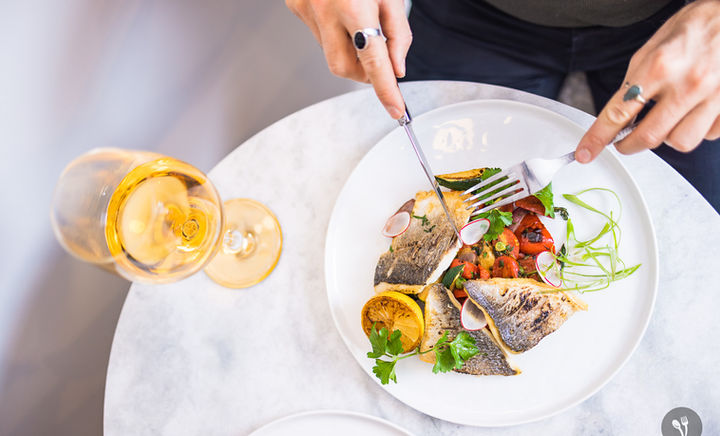 Fresh from the Mediterranean Sea. Sea bass grilled with Tuscan herbs, grilled lemon, & tomato and Calabrian chile salsa with white wine. Perfect for a private chef experience or as a family style