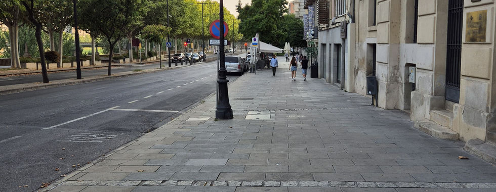 Looking down a road in Lleida, Spain, from one of the tourist bus bus stops