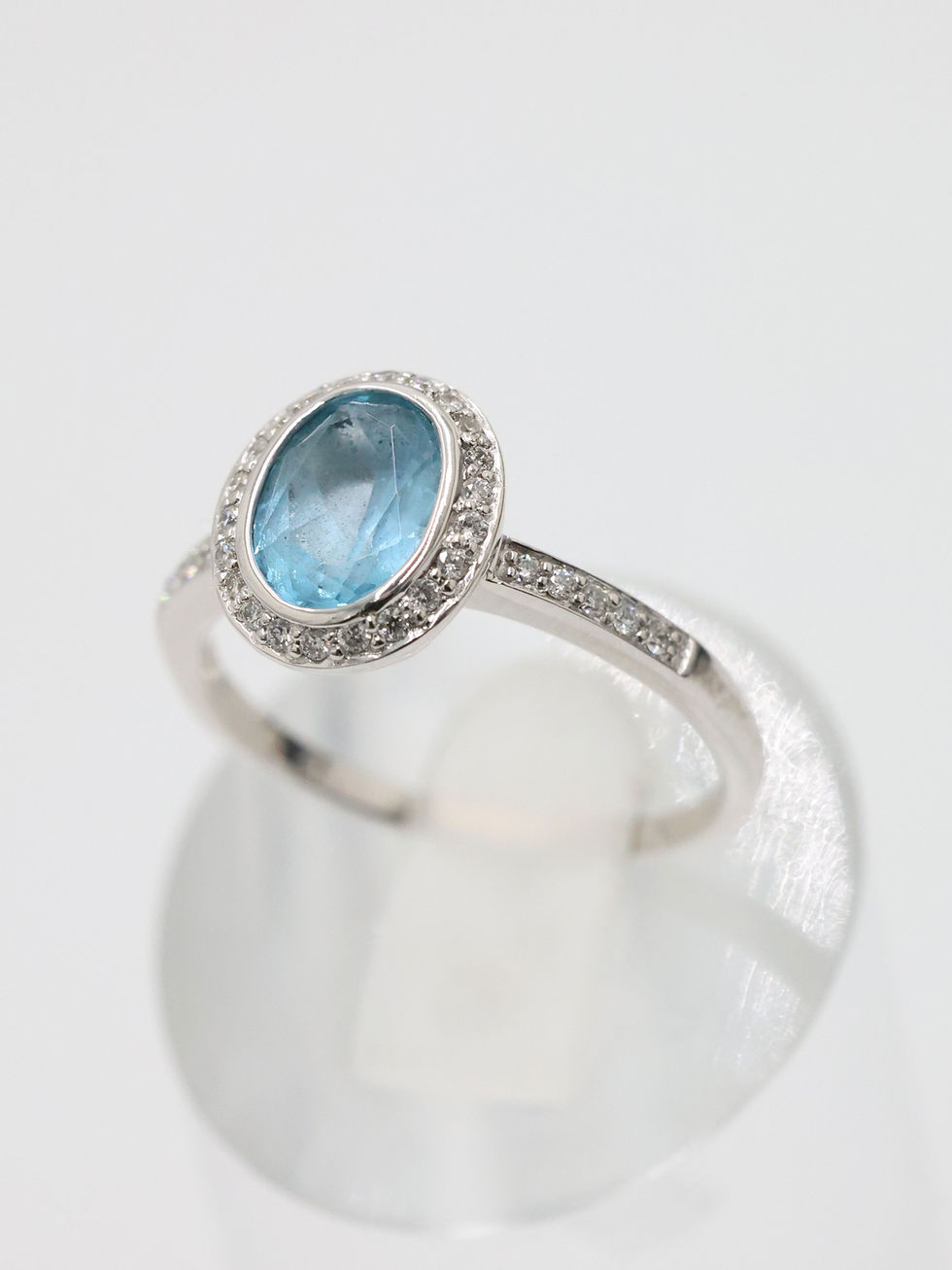 Thumbnail: 18ct White Gold Oval Blue Topaz & Diamond Halo with Shoulders Ring