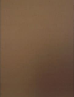 A sand dune in a desert with a beige sky