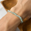 Thumbnail: Icy White and Green Flat Beads Bracelet