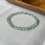 Thumbnail: Icy White and Green Flat Beads Bracelet