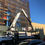 Thumbnail: Crane unloading construction materials at building site