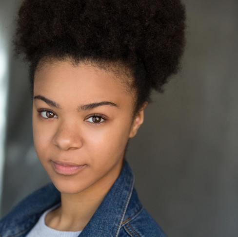 Actress India Amerteifio with natural hair curly afro and no makeup