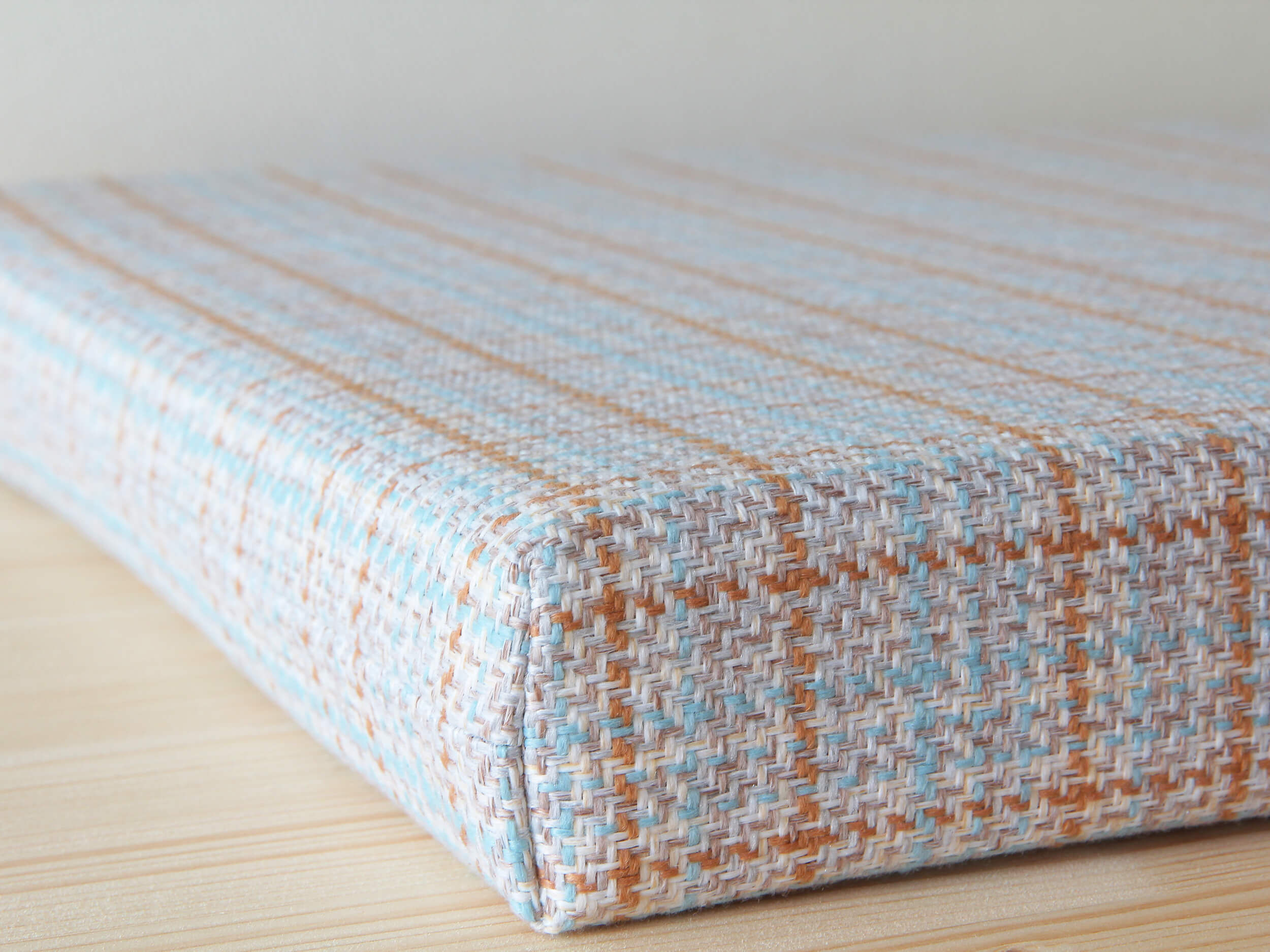 Custom seat pad with plaid cover