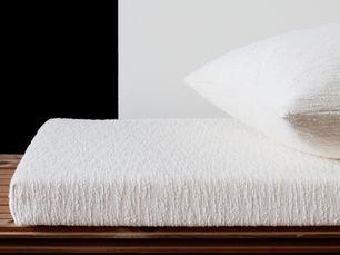 White boucle bench cushion  and a decorative pillow crafted to order