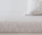 Warm creamy white modern banquette cushion in custom size