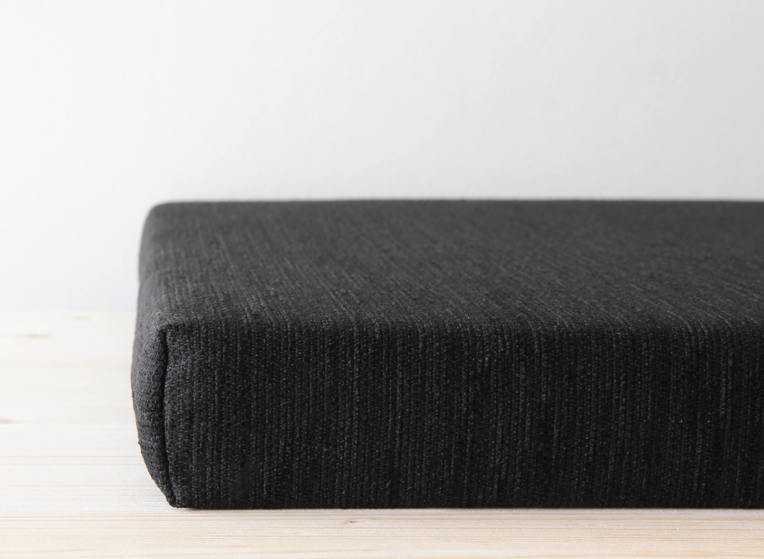 Solid black bench cushion in custom sizes