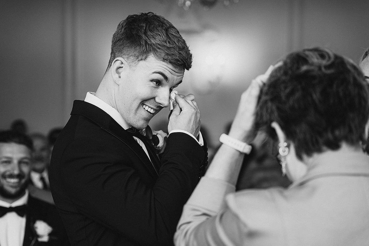 Groom crying emotion in wedding ceremony at rockbeare manor