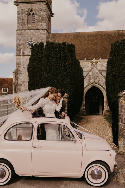 church wedding- vintage pink car - bride and groom - editorial photography 