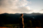 Man contemplating vast mountain landscape: fear of death and death anxiety existential therapy grief counselling online Australia at Colibri Counselling Sydney
