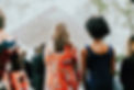 Two women supporting each other at a funeral — grief counselling and psychotherapy Sydney