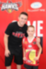 Rotnei Clarke with future Hawk (2024/25) Bradley Ballinger in January 2014.