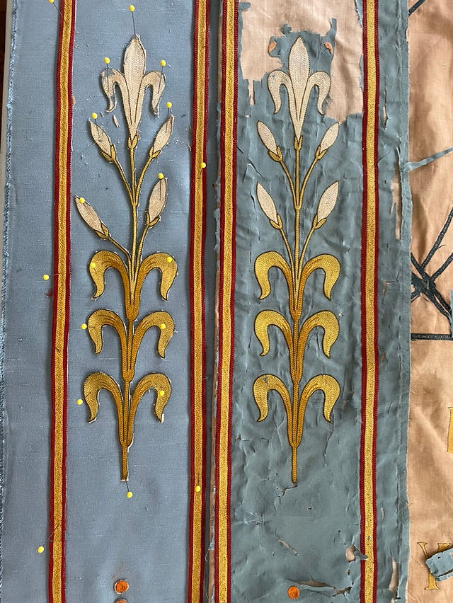 Lily on side panel before and during restoration