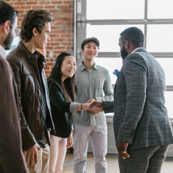 An investor speaking to a group of members of a company that are looking to raise funds.