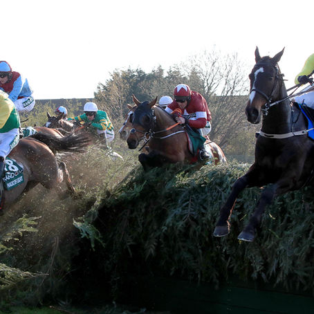 ··· Tiger Roll (centre) ridden by jockey Davy Russell jumps Becher's Brook on the way to winning the Randox Health Grand National Handicap Chase during Grand National Day of the 2019 Randox Health Grand National at Aintree.
