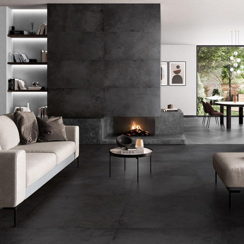 black metal effect tiles on a chimney feature wall in a living room and dining room.