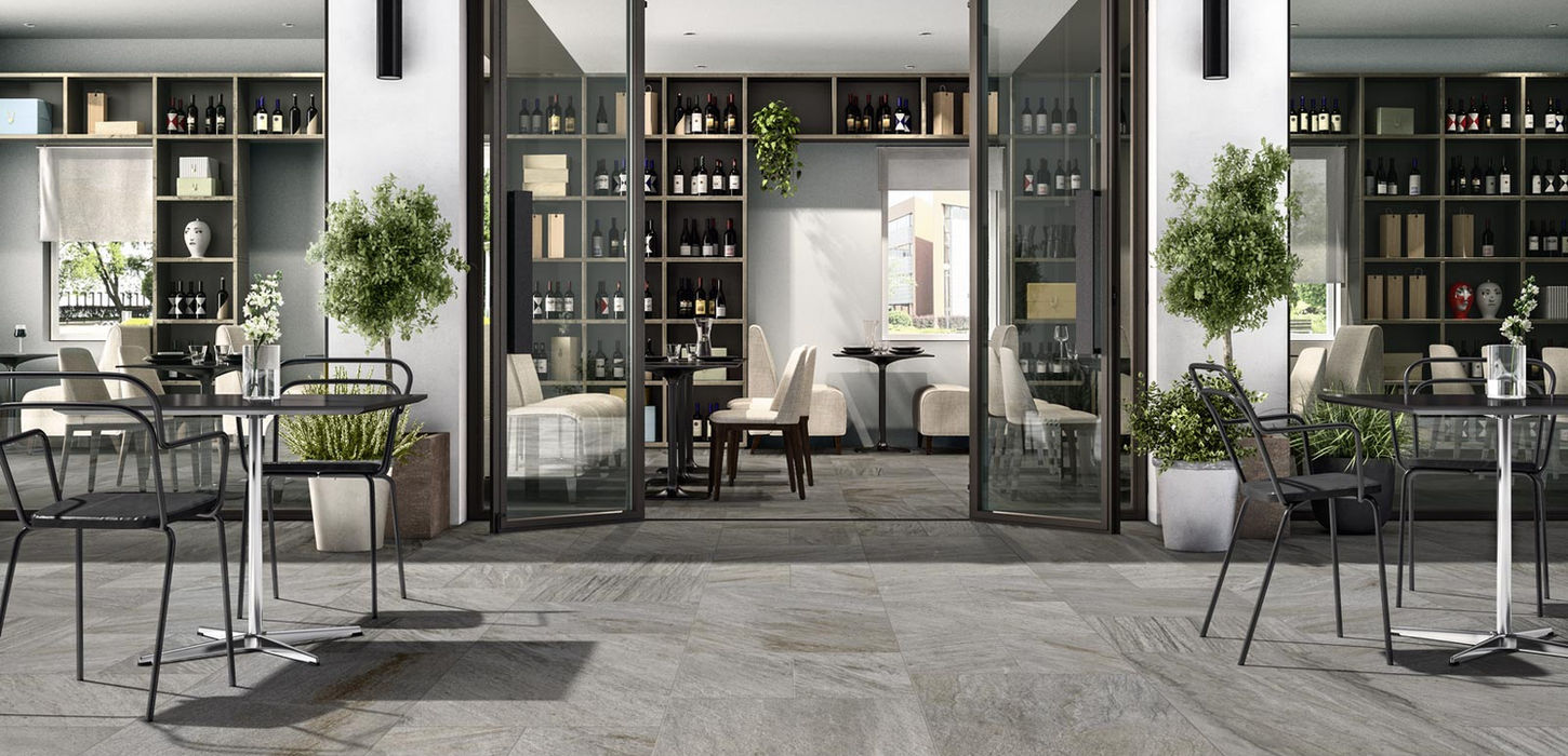 Armatile Camino outdoor porcelain paving tiles on contemporary terrace dining area