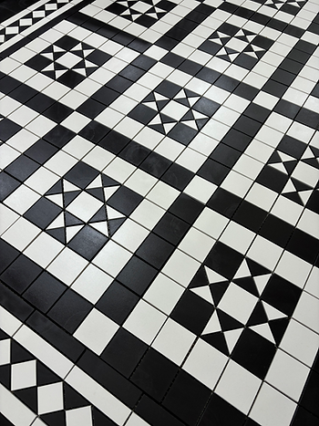 Black and white Victorian geometric floor with borders