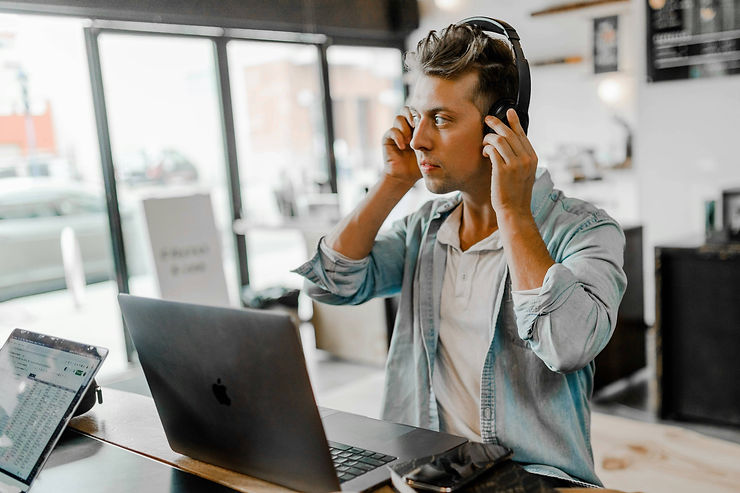 Remote worked putting on headphones