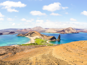 Pinnacle Rock in the Galapagos Islands with turquoise waters and volcanic terrain.