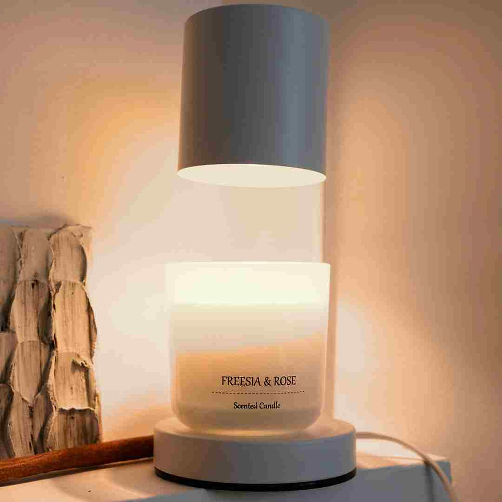 Candle warmer lamp and a candle with the text Freesia and Rose