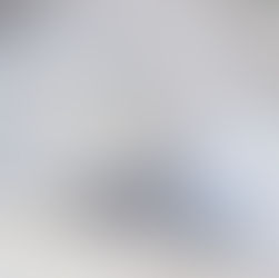 a concrete planter with pot feet placed next to it