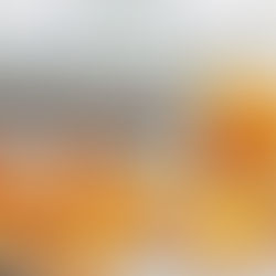 photograph of fresh orange peels drying on a white baking tray, thinly sliced citrus peels arranged loosely, a small clear glass jar partially filled with dried orange peel strips in the background.