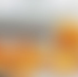 photograph of fresh orange peels drying on a white baking tray, thinly sliced citrus peels arranged loosely, a small clear glass jar partially filled with dried orange peel strips in the background.