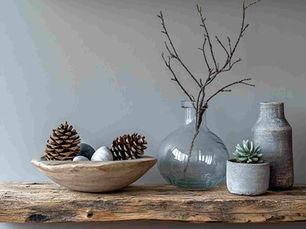 floating wood shelf with natural objects (pine cones, plants) and vase