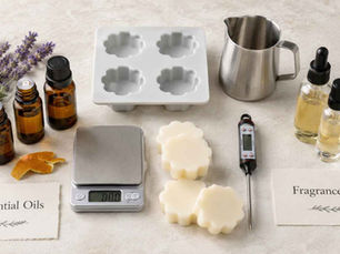 Essential oils and fragrance oils compared for wax melts with amber bottles, botanicals, moulds and candle-making tools.