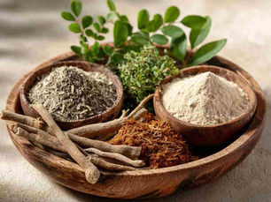 A modern, minimal Ayurvedic sleep setup on a clean bedside table: white ceramic cup with herbal tea, Ashwagandha herbs and few green leaves (Brahmi)in a small bowl