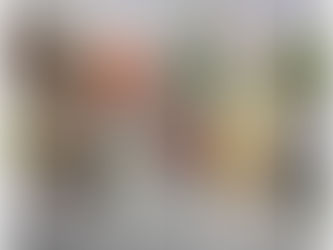 Muted grey Scandinavian flat lay with dried orange slices, cinnamon sticks, bay leaves and cloves on a stone surface, creating a warm, calming winter mood.