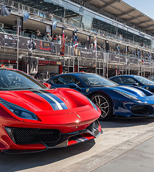 u4664179765_A_line_of_Ferrari_cars_in_red_and_blue_parked_on__f5f90495-ec5f-4c92-ba1b-d8c7