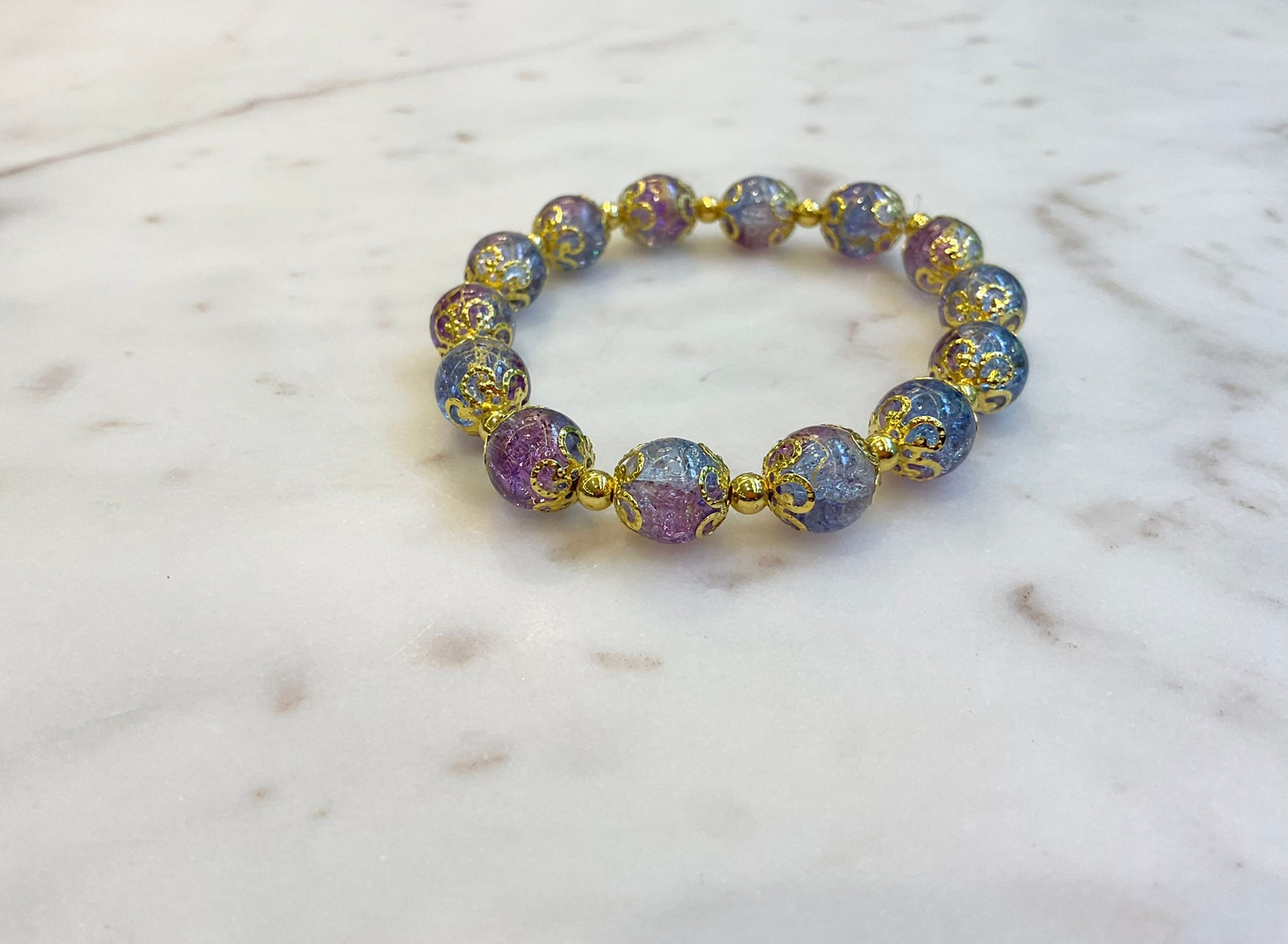 Blue, purple and gold beaded bracelet