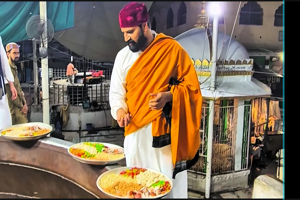 Spiritual moment of a devotee making dua in Ajmer Sharif courtyard