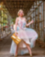 miss audrey monroe modeling a 1980s inspired dress for aw bridal