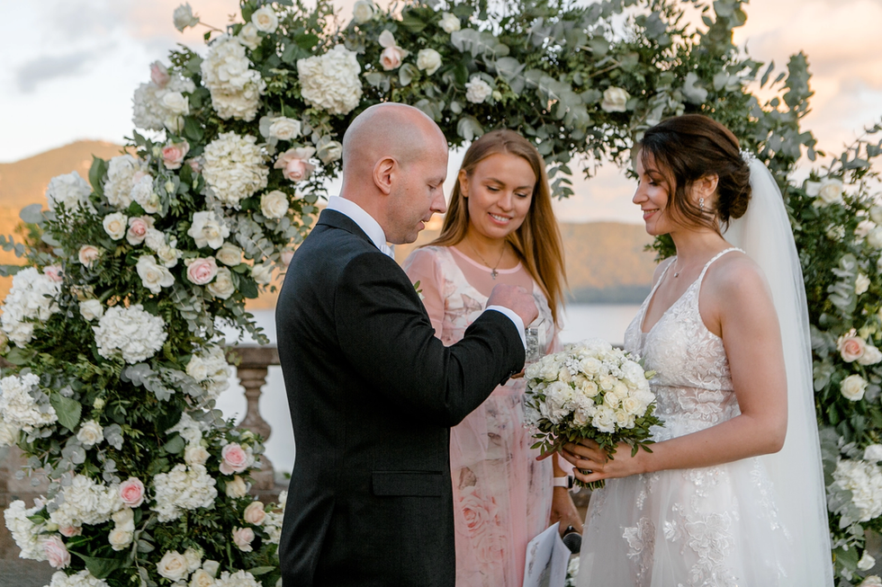 Groom and bride exchanging rings during a symbolic ceremony