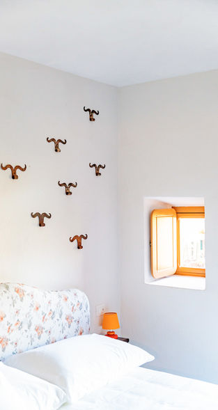 Bright and beautiful room with custom floral headboard at the historic Tenuta Miranda bed & breakfast in Piedmont, Italy