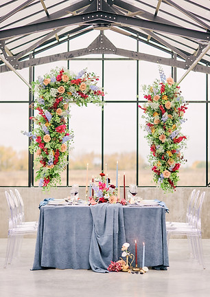 Luxury wedding reception with focal-point floral design emphasizing the dinner table and elegant wedding décor captured bt Baskin Creative Co., a Canadian wedding photographer