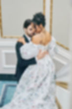 Groom holding bride on staircase captured by Baskin Creative Co., Regina wedding photographer