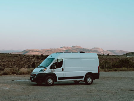 White passenger van on road