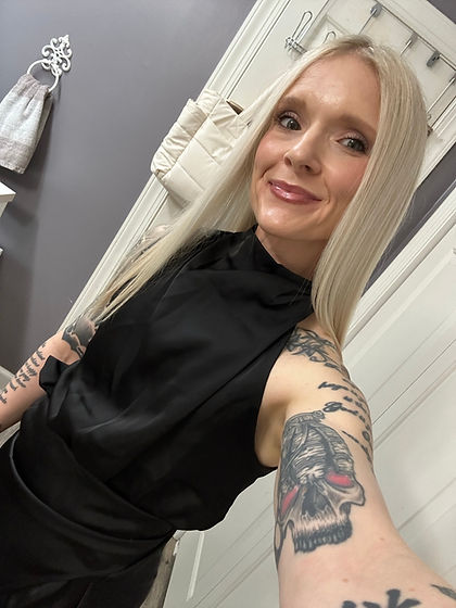Erica Noggle celebrating her birthday in a black sleeveless outfit.