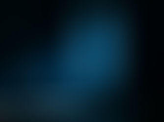 An empty armchair in a dark room with cold blue light falling through a curtained window