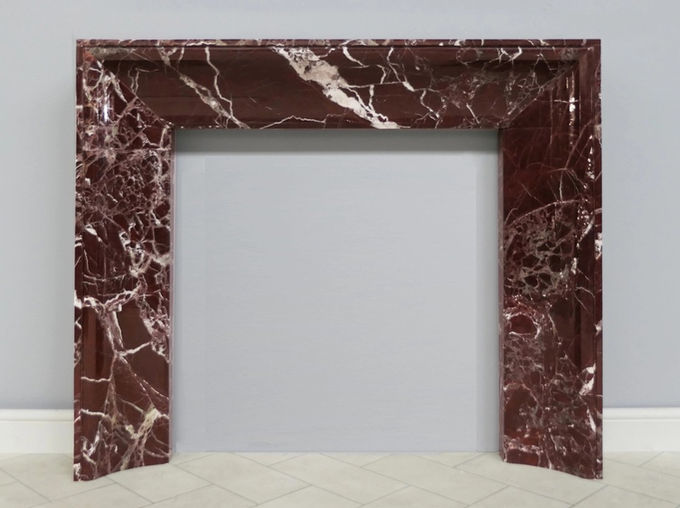 Lambeth fireplace surround in Rosso Levanto marble. . It is deep burgundy in colour with intricate white veins and occasional variations in tone