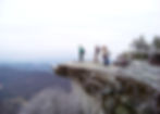 Hikers standing at the top of McAfee's Knob